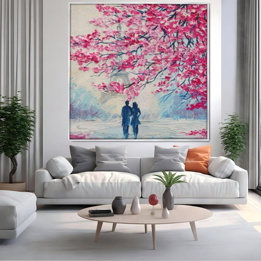 Tablou canvas cu tablou patrat cuplu sub pom roz, in rama de aluminiu argintiu, pe perete intr-un living